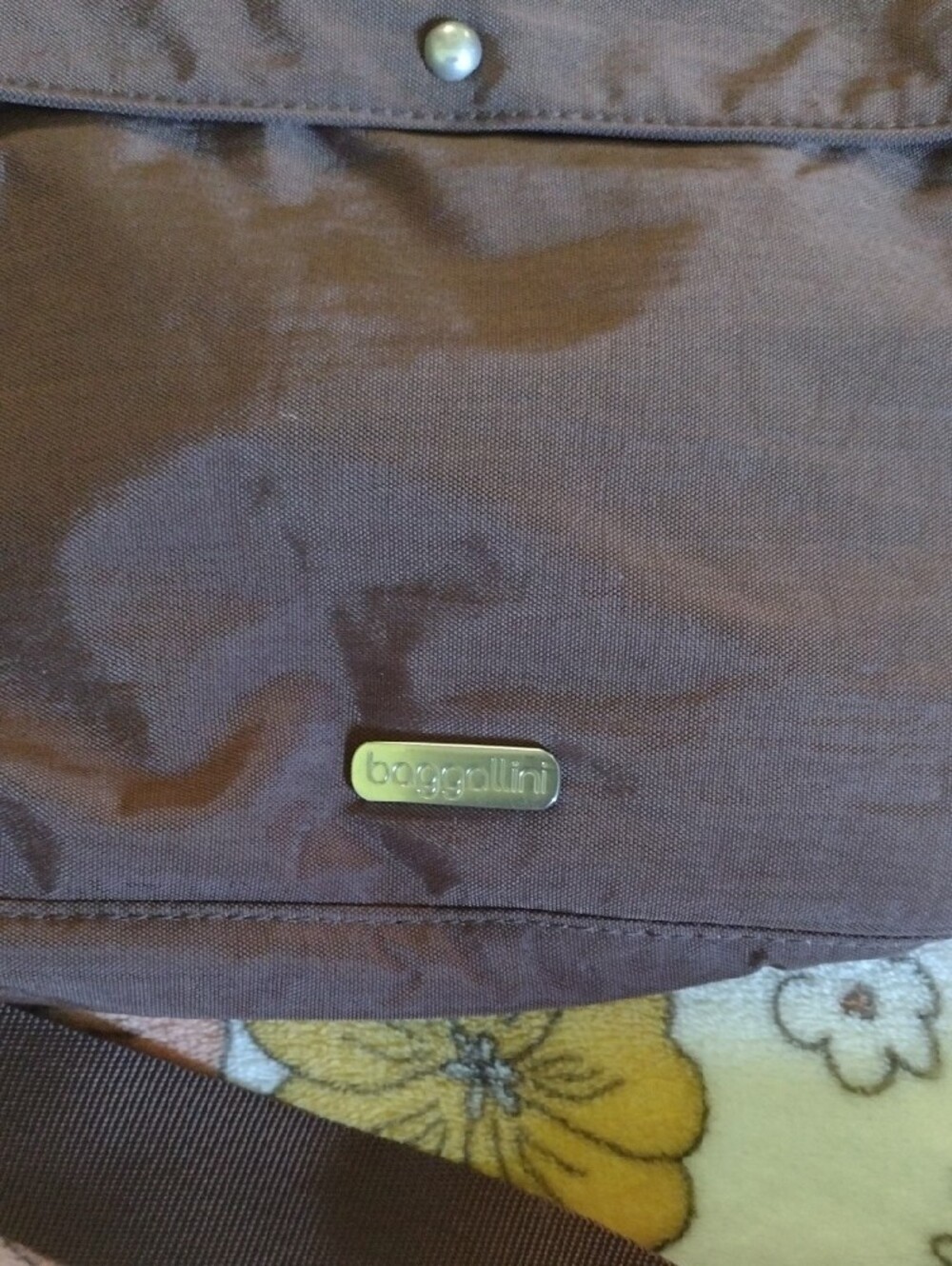 Baggalini brown messenger crossbody designed for everyday use.